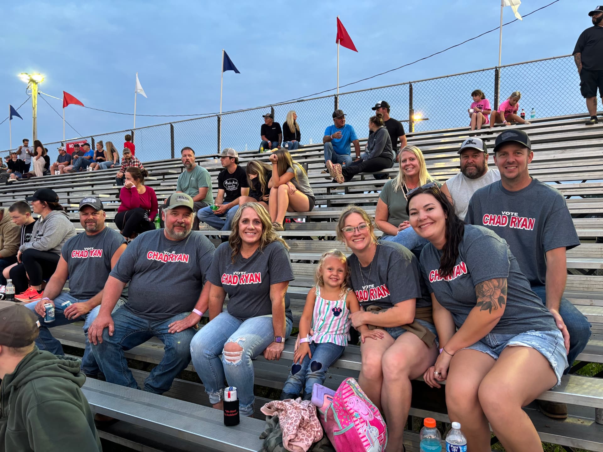 Chad Ryan with family and supporters in Vote Chad Ryan shirts in the grandstands at a Goodhue County Minnesota community event.
